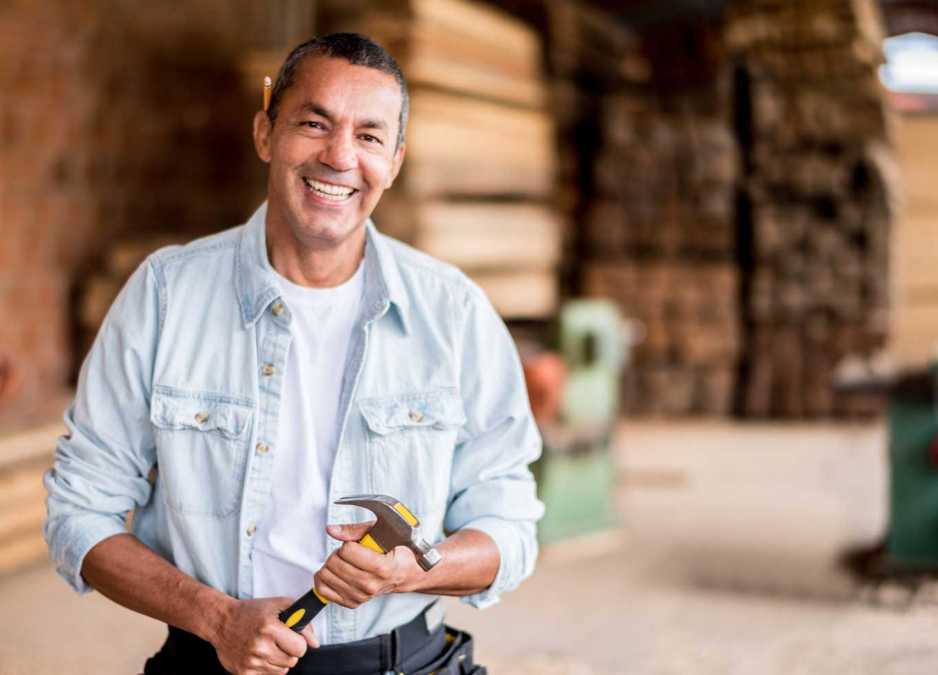 smiling man holding hammer